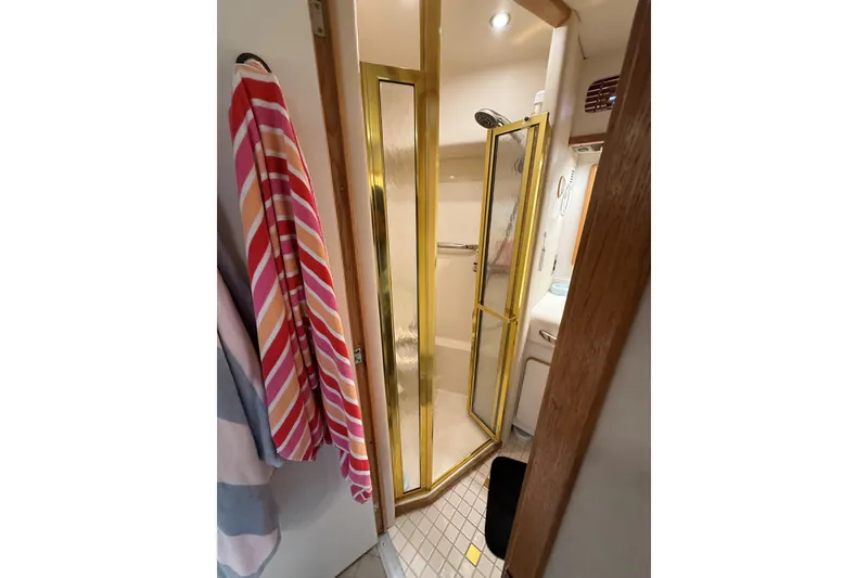 Slide: The Image of Bathroom interior of 1994 Sea Ray 500 Sundancer yacht with gold-framed shower. - 37