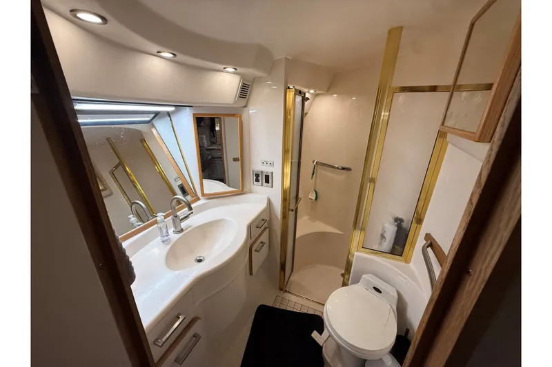 Slide: The Image of Luxurious bathroom in 1994 Sea Ray 500 Sundancer yacht with modern fixtures and lighting. - 46