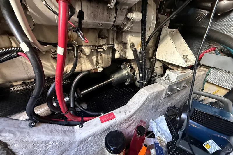 Slide: The Image of Engine compartment of a 1994 Sea Ray 500 Sundancer with visible wiring and components. - 57