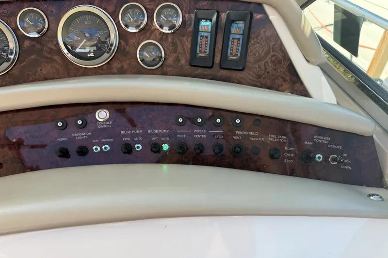 Slide: The Image of Control panel of a 1994 Sea Ray 500 Sundancer boat with gauges and switches. - 20