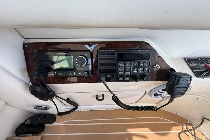 Slide: The Image of Control panel of a 1994 Sea Ray 500 Sundancer with Raymarine and Standard Horizon equipment. - 14