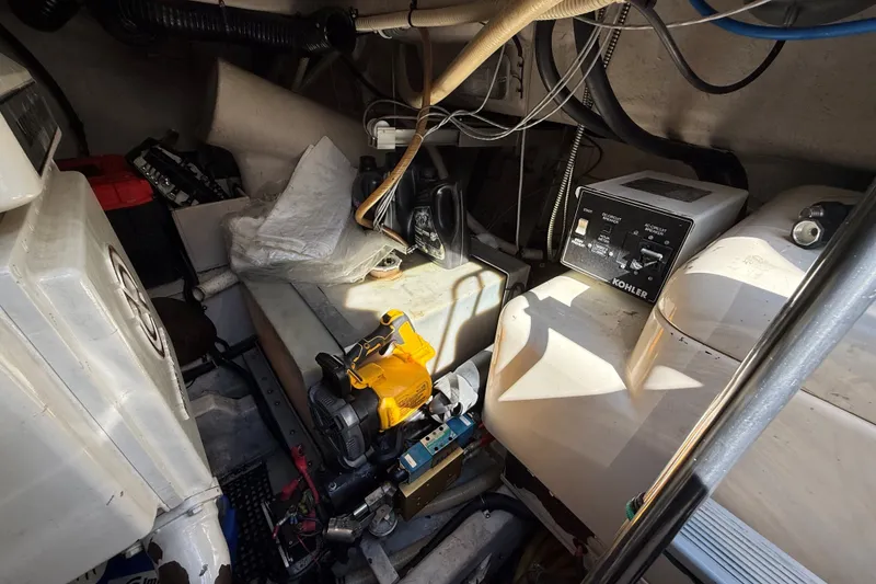 Slide: The Image of Engine room of a 1994 Sea Ray 500 Sundancer with Kohler generator and various equipment. - 53
