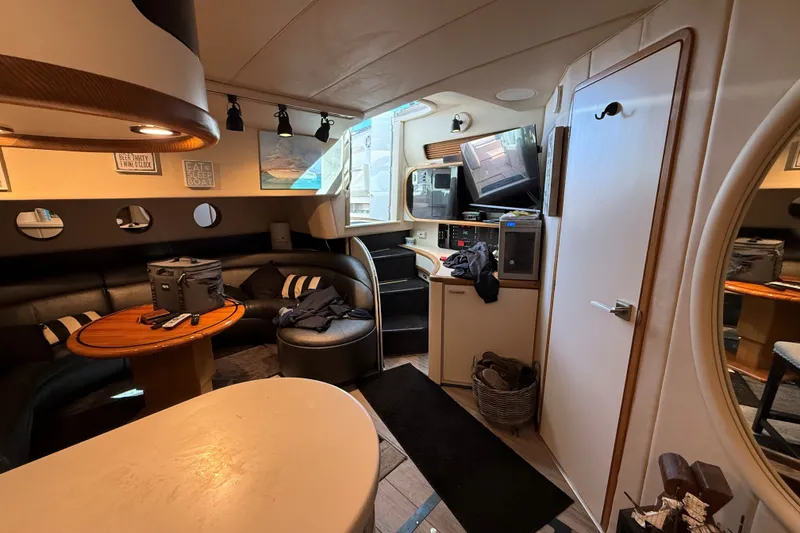 Slide: The Image of Interior of a 1994 Sea Ray 500 Sundancer yacht with cozy seating and modern amenities. - 31