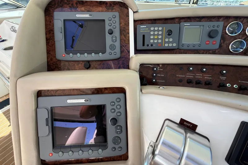 Slide: The Image of Control panel of a 1994 Sea Ray 500 Sundancer yacht with navigation equipment. - 16
