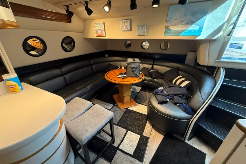 Slide: The Image of Luxurious interior of a 1994 Sea Ray 500 Sundancer yacht with leather seating and modern decor. - 29