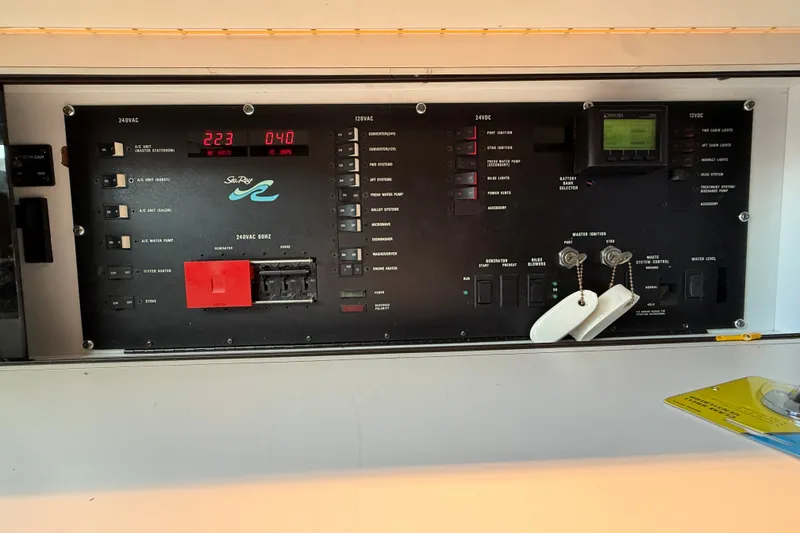 Slide: The Image of Control panel of a 1994 Sea Ray 500 Sundancer yacht, displaying various switches and indicators. - 49