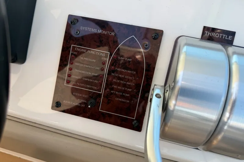 Slide: The Image of 1994 Sea Ray 500 Sundancer systems monitor panel with throttle control. - 22