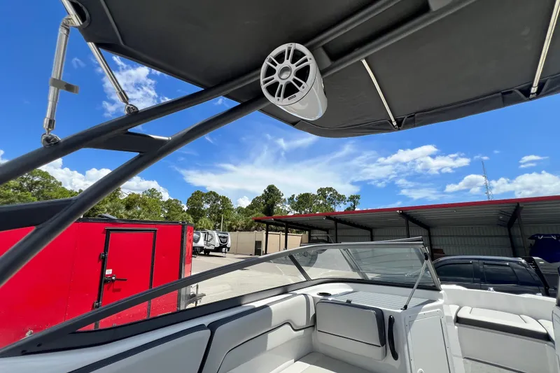 Slide: The Image of 2022 Yamaha AR190 boat interior with speaker and canopy under blue sky. - 25