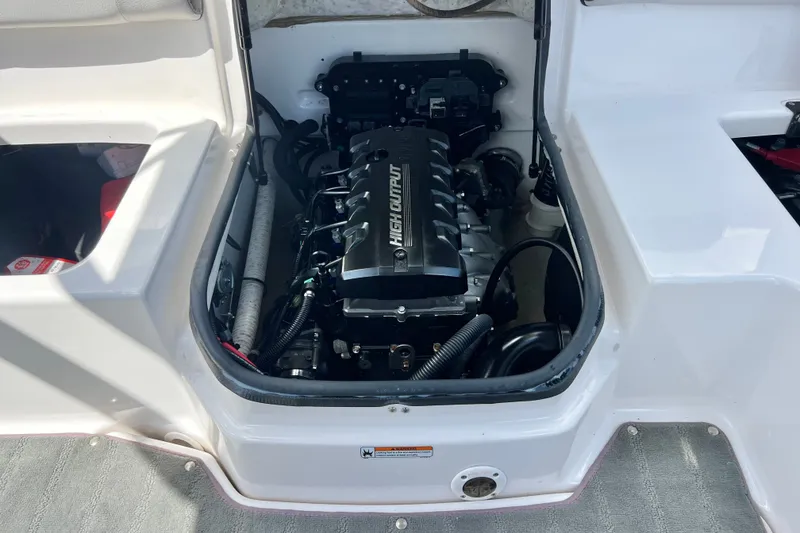 Slide: The Image of Engine compartment of a 2022 Yamaha Boats AR190, showcasing high output engine. - 52
