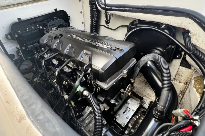 Slide: The Image of Engine compartment of a 2022 Yamaha Boats AR190, showcasing the powerful motor. - 58