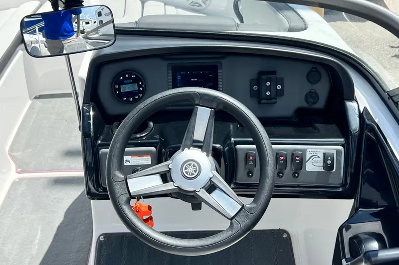 Slide: The Image of 2022 Yamaha Boats AR190 dashboard with steering wheel and control panel. - 29