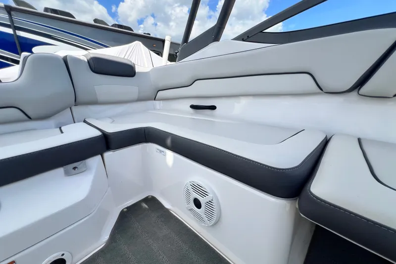 Slide: The Image of 2022 Yamaha Boats AR190 interior seating with sleek design and integrated speaker system. - 50