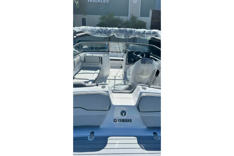 Slide: The Image of 2022 Yamaha Boats AR190 interior view, showcasing seating and steering area. - 3