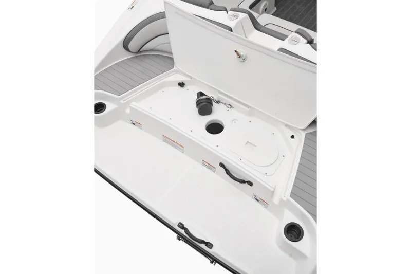 Slide: The Image of 2022 Yamaha Boats AR190 storage compartment with open hatch, showcasing interior details. - 7