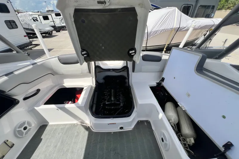 Slide: The Image of 2022 Yamaha Boats AR190 interior with open engine compartment and storage areas. - 51