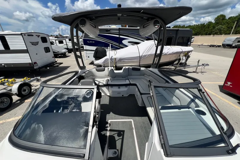 Slide: The Image of 2022 Yamaha Boats AR190 with sleek interior and modern design, parked outdoors. - 44