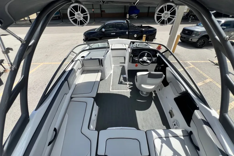 Slide: The Image of 2022 Yamaha Boats AR190 interior with seating, steering wheel, and speakers. - 17