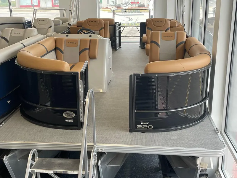 Slide: The Image of 2024 Crest 220SLC Classic LX pontoon boat with luxurious seating and modern design. - 8