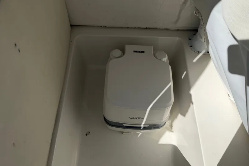 Slide: The Image of Portable toilet in 2023 Sea Hunt Ultra 234 boat compartment. - 16