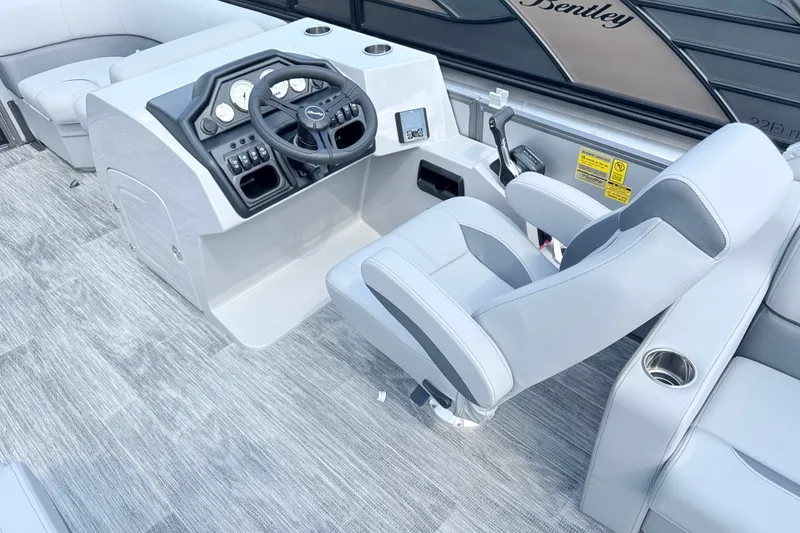 Slide: The Image of 2027 Bentley Pontoons Legacy 200 Navigator helm with modern controls and comfortable seating. - 11