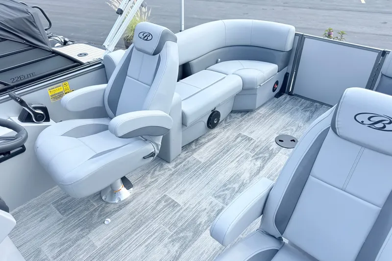 Slide: The Image of 2027 Bentley Pontoons Legacy 200 Navigator interior with luxurious seating and modern design. - 13