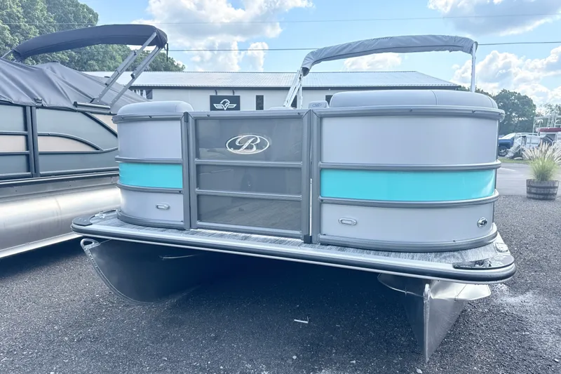 Slide: The Image of 2027 Bentley Pontoons Legacy 200 Navigator, sleek design, docked outdoors under a blue sky. - 2