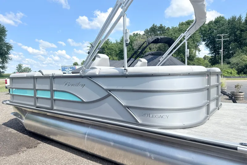 Slide: The Image of 2027 Bentley Pontoons Legacy 200 Navigator on a sunny day, showcasing sleek design. - 4