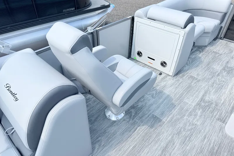 Slide: The Image of 2027 Bentley Pontoons Legacy 200 Navigator interior with luxurious seating and modern design. - 10