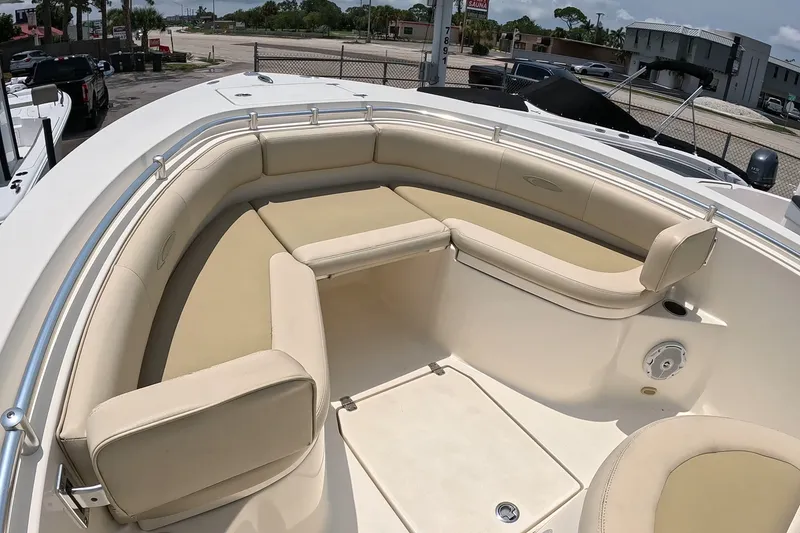 Slide: The Image of 2015 Cobia 237 Center Console boat with spacious seating and sleek design. - 14