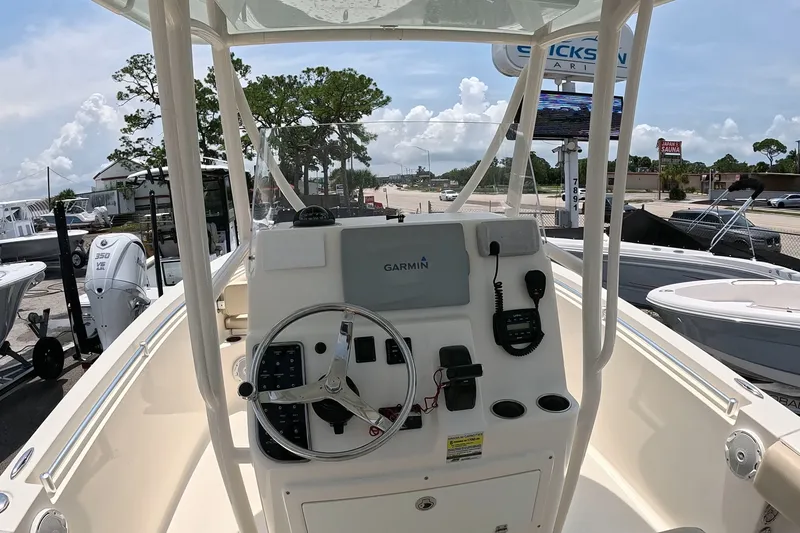 Slide: The Image of 2015 Cobia 237 Center Console boat dashboard with Garmin navigation system. - 18