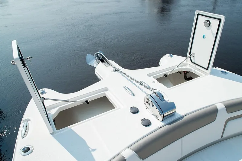 Slide: The Image of Manufacturer Provided Image: Bow of 2026 World Cat 296 DC boat with anchor storage compartments open. - 8