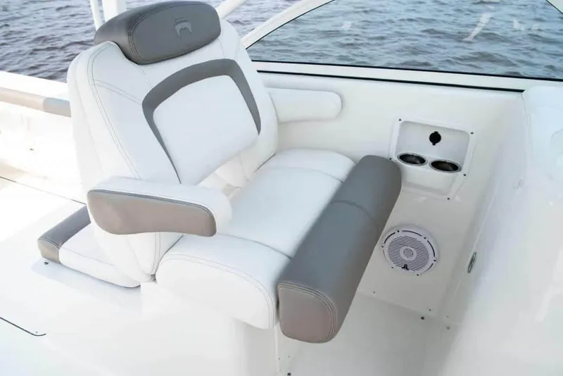 Slide: The Image of Manufacturer Provided Image: Luxury seating on 2026 World Cat 296 DC boat, featuring white and gray upholstery. - 15