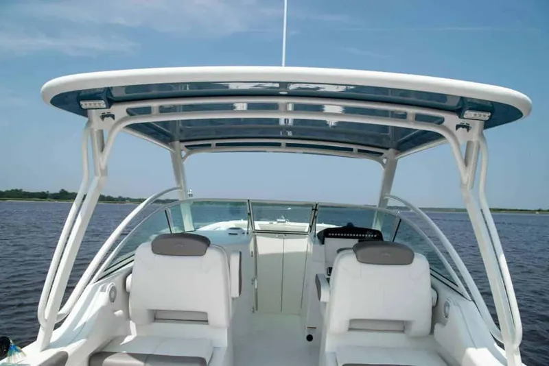 Slide: The Image of Manufacturer Provided Image: 2026 World Cat 296 DC boat with dual console seating on open water. - 17