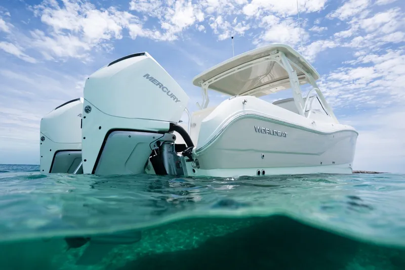 Slide: The Image of 2027 World Cat 296 DC boat with Mercury engines on clear ocean water. - 4