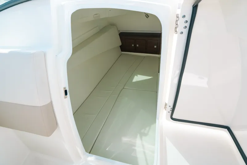 Slide: The Image of Interior cabin of 2024 Boston Whaler 320 Vantage, featuring comfortable seating and storage. - 61