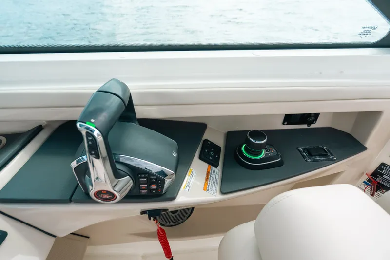 Slide: The Image of 2024 Boston Whaler 320 Vantage helm controls with joystick and throttle. - 37