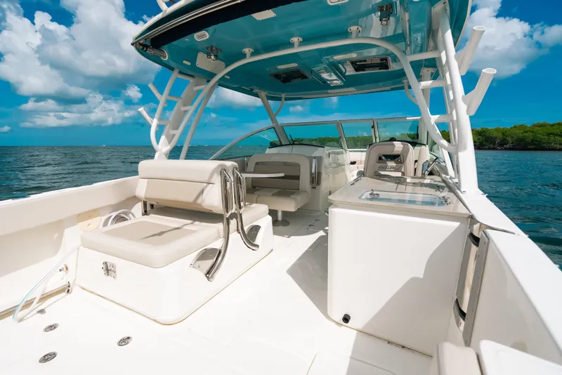 Slide: The Image of 2024 Boston Whaler 320 Vantage boat interior with seating and ocean view. - 42