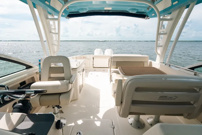Slide: The Image of 2024 Boston Whaler 320 Vantage boat interior with seating and ocean view. - 39