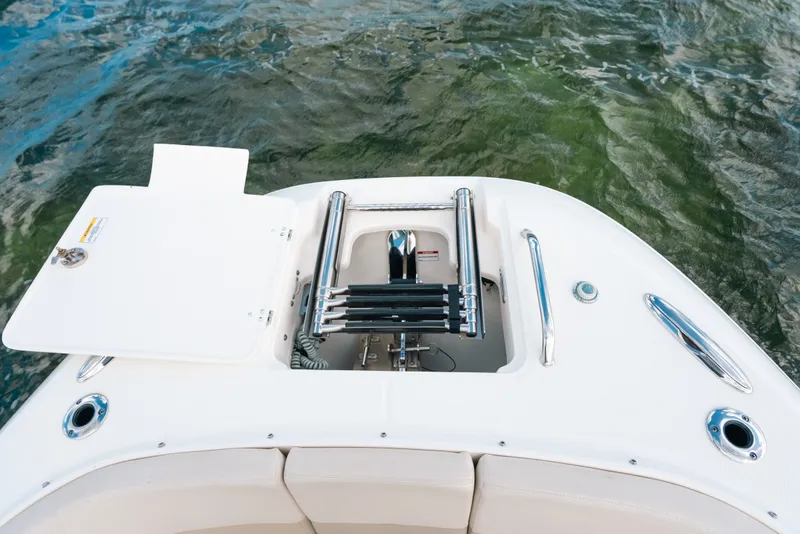 Slide: The Image of 2024 Boston Whaler 320 Vantage boat ladder and deck detail on water. - 25