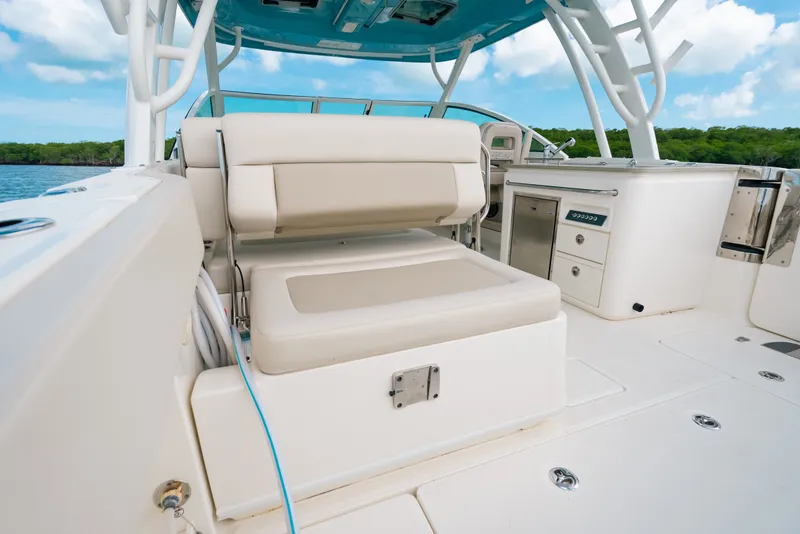 Slide: The Image of 2024 Boston Whaler 320 Vantage interior with seating and storage, showcasing luxury and functionality. - 27