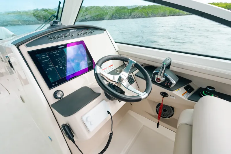 Slide: The Image of 2024 Boston Whaler 320 Vantage helm with advanced navigation system and controls. - 35