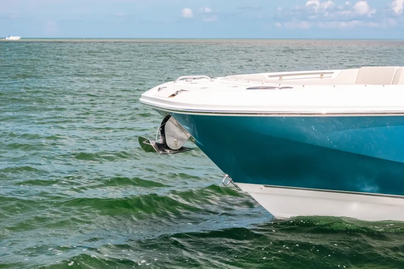 Slide: The Image of 2024 Boston Whaler 320 Vantage boat on calm ocean waters. - 16