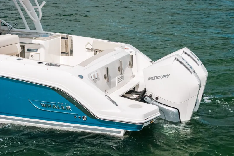 Slide: The Image of 2024 Boston Whaler 320 Vantage with dual Mercury engines on the water. - 15