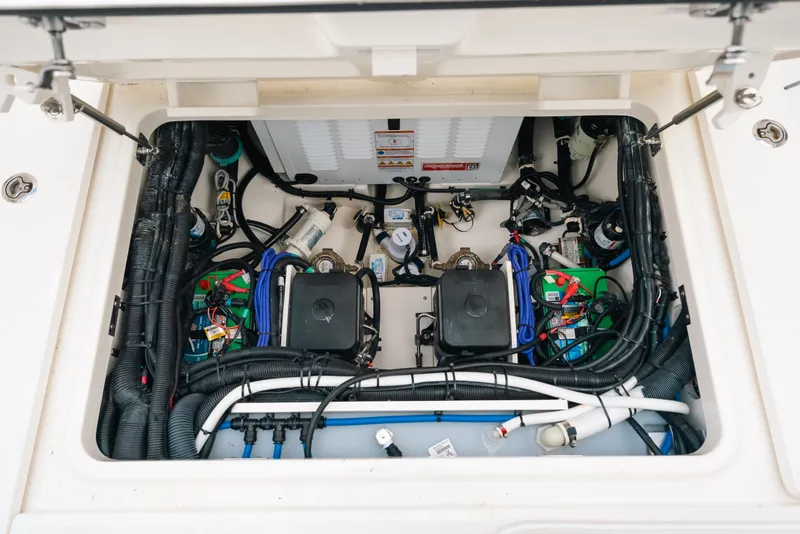 Slide: The Image of Engine compartment of 2024 Boston Whaler 320 Vantage, showcasing wiring and components. - 51
