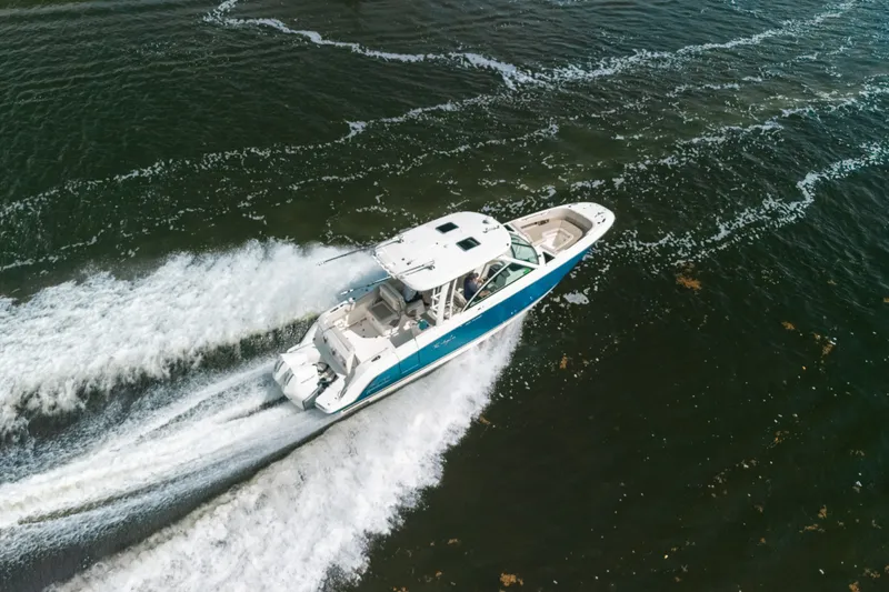 Slide: The Image of Aerial view of 2024 Boston Whaler 320 Vantage cruising on open water. - 20