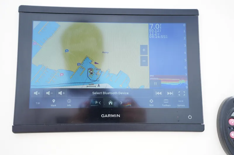 Slide: The Image of Garmin navigation display on 2022 Grady-White Freedom 215 boat, showing map and controls. - 22