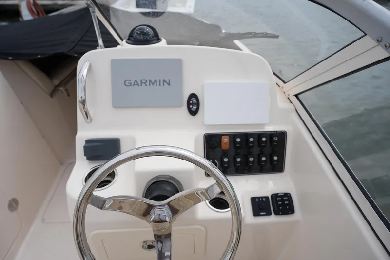 Slide: The Image of 2022 Grady-White Freedom 215 boat dashboard with Garmin navigation system. - 20