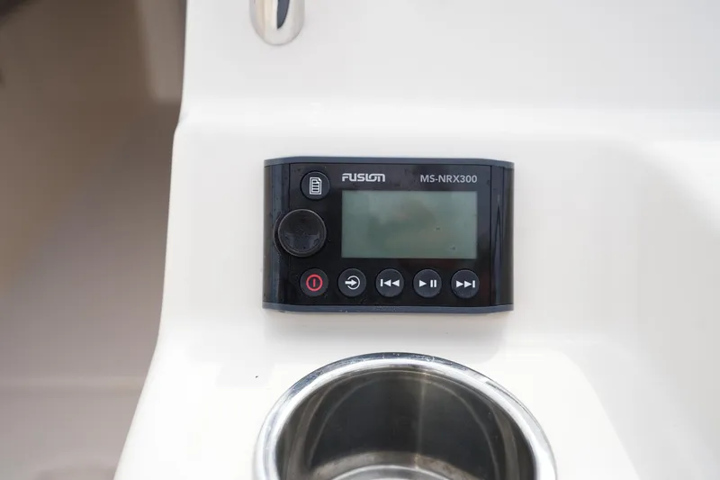 Slide: The Image of Fusion MS-NRX300 stereo system on 2022 Grady-White Freedom 215 boat dashboard. - 23