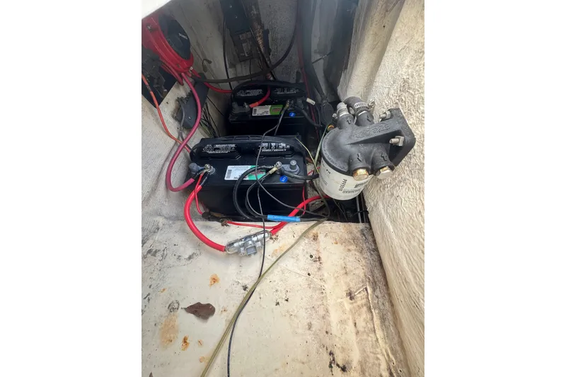 Slide: The Image of Battery compartment of a 1993 Hydra-Sports 2300 CC boat with wiring and filter. - 7