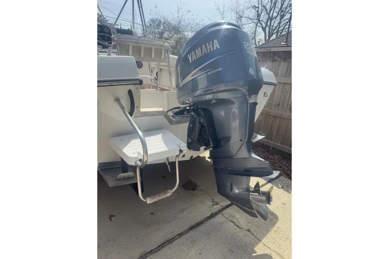 Slide: The Image of 1993 Hydra-Sports 2300 CC boat with Yamaha outboard motor in a driveway. - 12